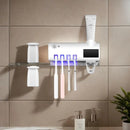 Wall mounted toothpaste dispenser toothbrush slots,