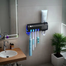 Wall mounted toothpaste dispenser toothbrush slots,